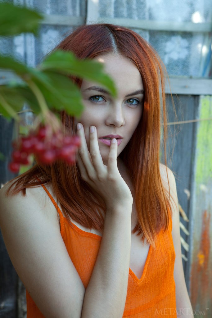 Shaya - Amazing redhead babe in a see-through orange dress