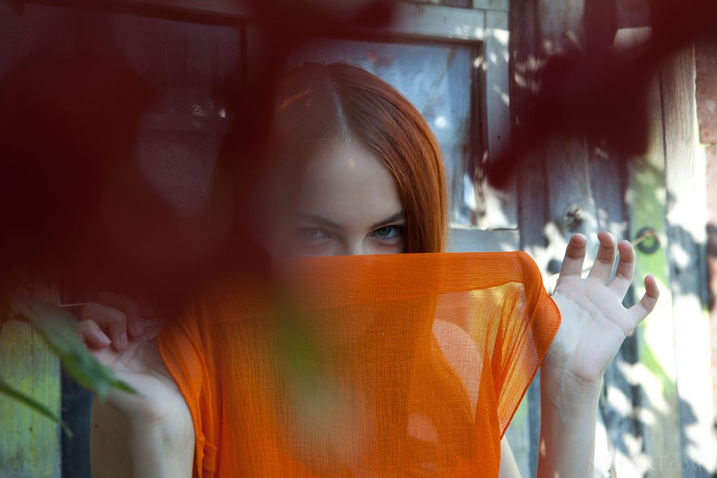 Shaya - Amazing redhead babe in a see-through orange dress