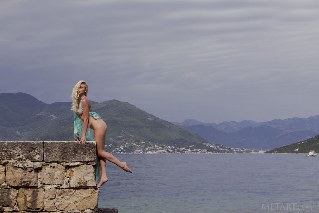 Nika N - Like a mermaid, slutty blonde shows off by the sea.