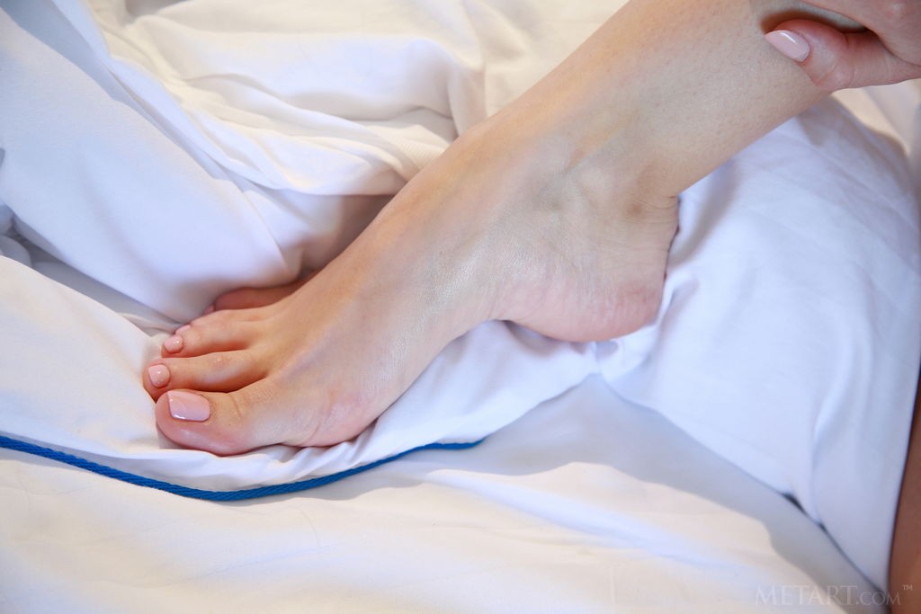 Linda Chase - Showing off her bare feet and perky teen tits on the bed