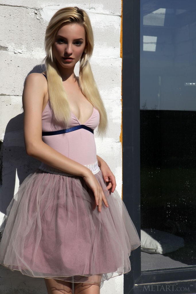 Kira W - While walking around outside she can't keep her dress on