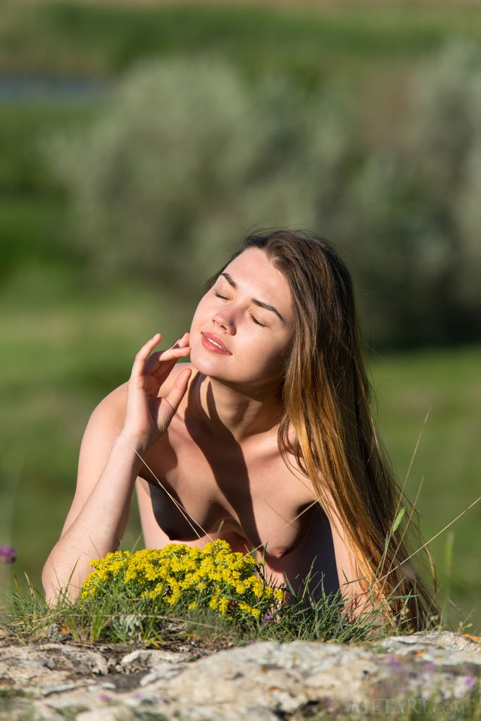 Georgia - Totally naked cutie spends time on a riverbank
