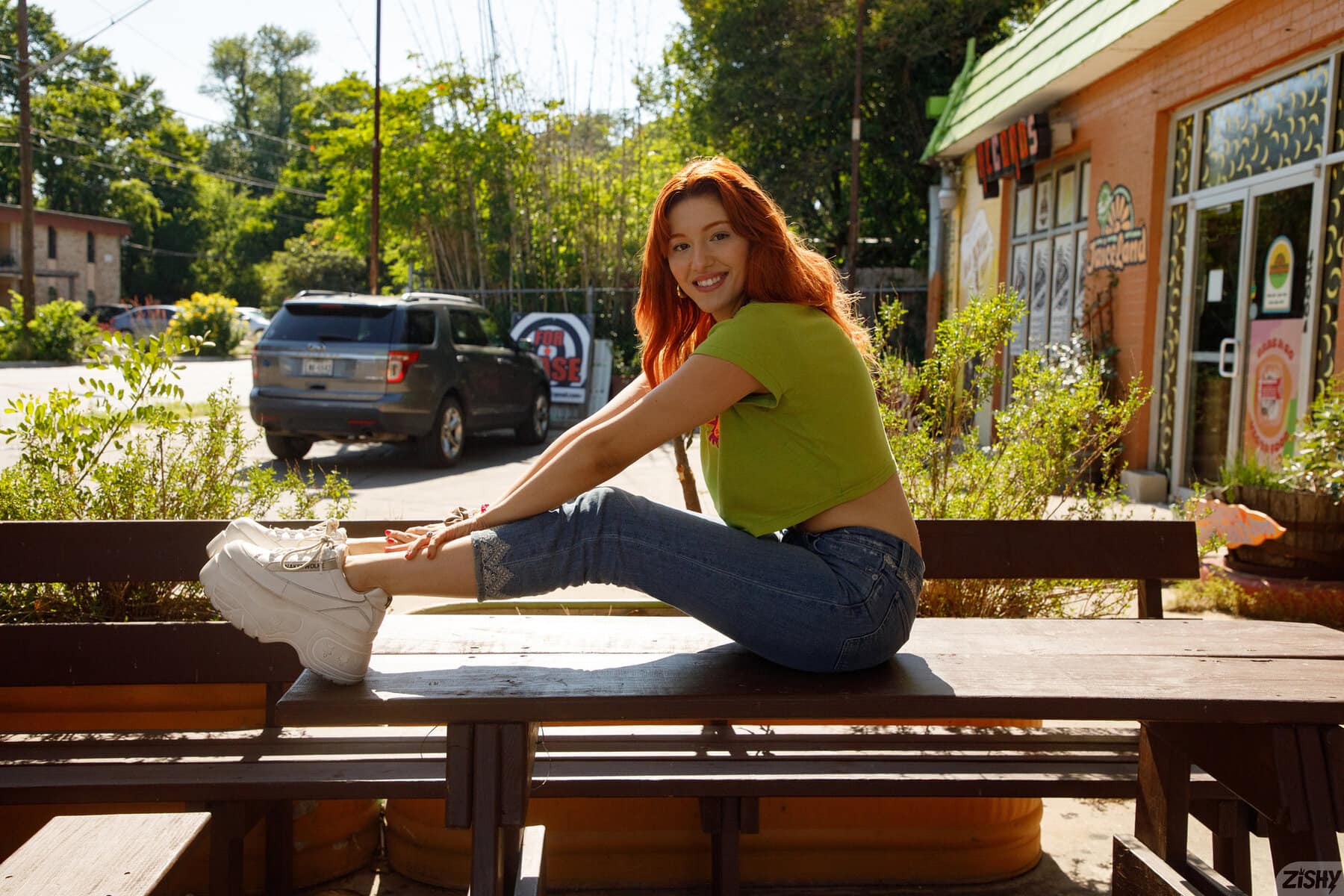 Keely Rose strips down jeans and panties while flaunting her curves outdoors